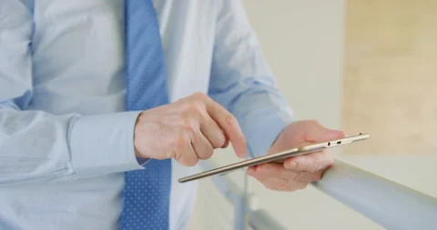 Male Professional Using Digital Tablet By Railing At Office 4K Stock Footage 92435643