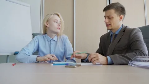 The male professor checks the solution of the problem during the privat Stock Footage 83191483