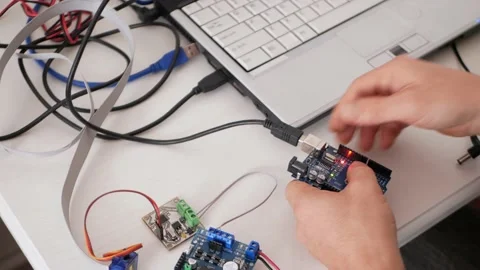 A male programmer creates robotics Stock-Footage 163815023