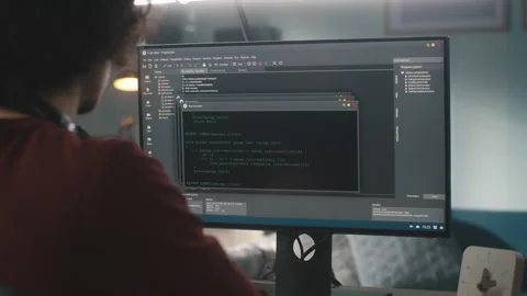 Male programmer creating code at home Stock Footage 164867643