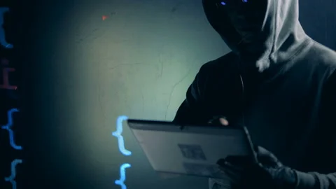 Male programmer is operating a tablet near projection of digital data Stock Footage 104209045