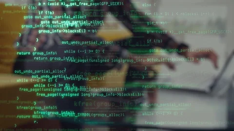 Male programmer types program code on laptop. Green source code overlay. Code Stock Footage 126037657