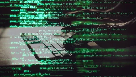 Male programmer types program code on laptop. Green source code overlay. Code Stock Footage 127225139