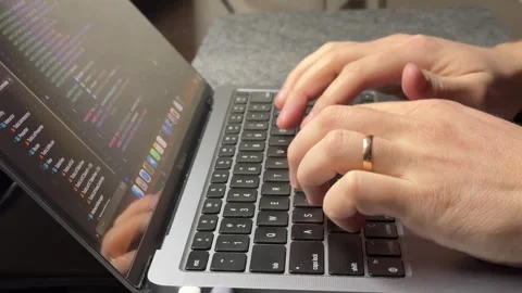 Male programmer typing code on laptop while working in IT company at work Stock Footage 306124418