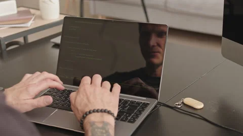 Male Programmer Typing Program Code on Laptop Video stock 171538596