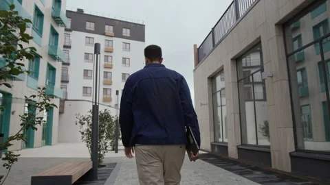 Male Programmer Walking in Street Video stock 320009989