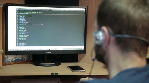 Male programmer working with code on screen Stock Footage 81040820