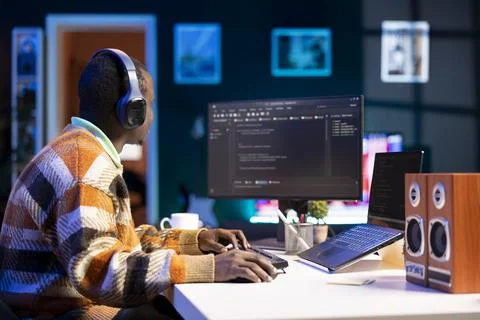 Male programmer working on developing new html script, Foto stock