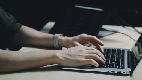 Male programmer working on new project.He working late at night at the office Stock Footage 312244058