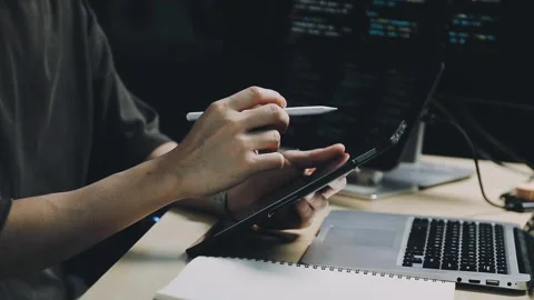 Male programmer working on new project.He working late at night at the office Stock Footage 312244064