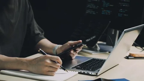 Male programmer working on new project.He working late at night at the office Stock Footage 312244068