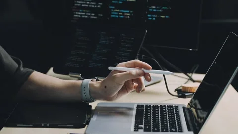 Male programmer working on new project.He working late at night at the office Stock Footage 312244070