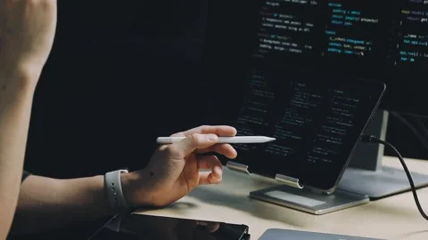 Male programmer working on new project.He working late at night at the office Stock Footage 312244071