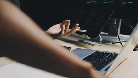 Male programmer working on new project.He working late at night at the office Stock Footage 312244072