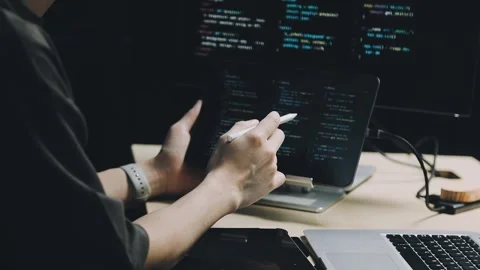 Male programmer working on new project.He working late at night at the office Stock Footage 312244073