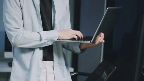 Male programmer working on new project.He working late at night at the office Stock Footage 312244091