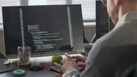 Male Programmer Working with Program Coding in Office at Daytime Stock Footage 306830521