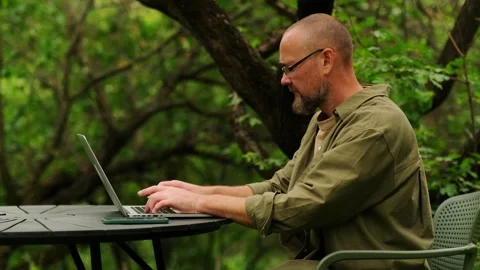 Male programmer working remotely. Digital nomad concept. Видео 242468553