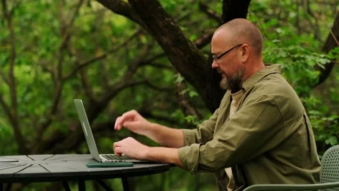 Male programmer working remotely. Digital nomad concept. Stock Footage 260998920