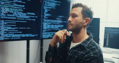 Male programmer write creative plan on whiteboard in home office. Stockbeeldmateriaal 344046781