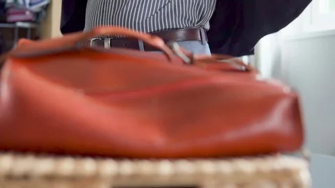 Male put on smart jacket Stock Footage 69797152