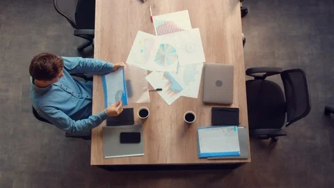 Male reading document at work Stock Footage 103098792
