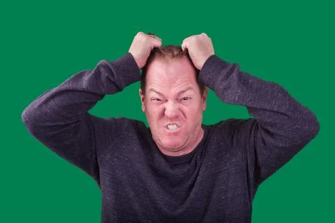 Male red haired man pulling his hair angry frustrated expression Stock Photos