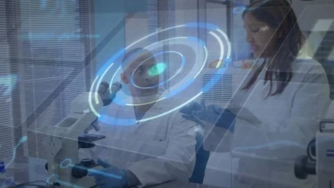 Male research scientist using microscope as holographic interface appearing and Stock Footage 317869798