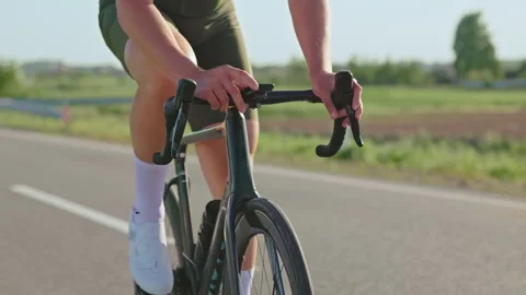Male rider checking data on cycling computer during workout Video stock 247135111