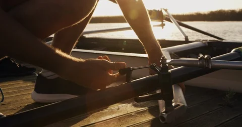 Male rower preparing boat before practice Stock Footage 126576214