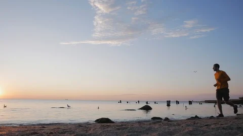 Male runner on the beach Stock Footage 92463709