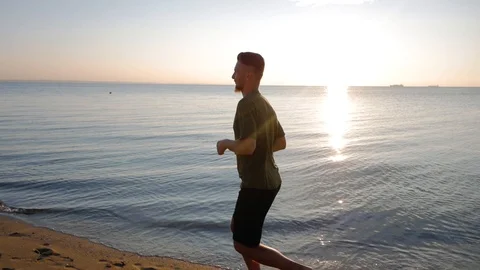 Male runner on the beach Stock Footage 92463866
