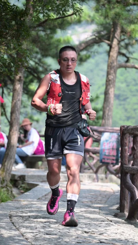 Male Runner in Black Singlet and Red Vest on Stone Trail, Lushan Stock Footage 346717029