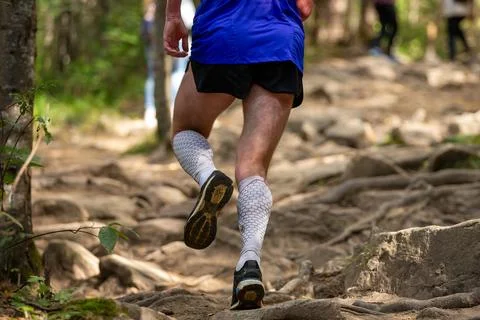 Male runner in compression socks running Stock Photos