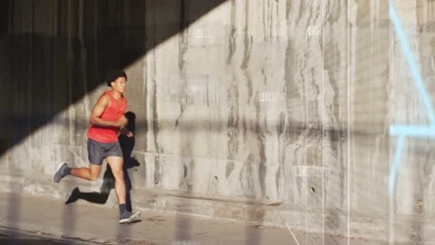 Male runner entering lit triangle, sprinting as blue schematic aligning with Stock Footage 332956372