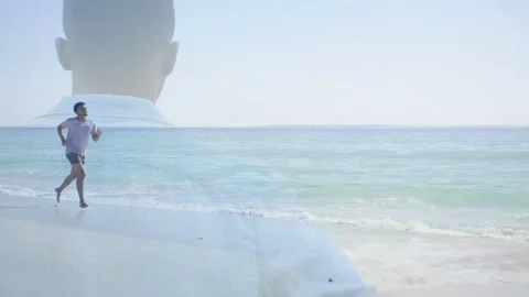Male runner entering shot jogging shoreline, faint silhouette growing and Stock Footage 333632174