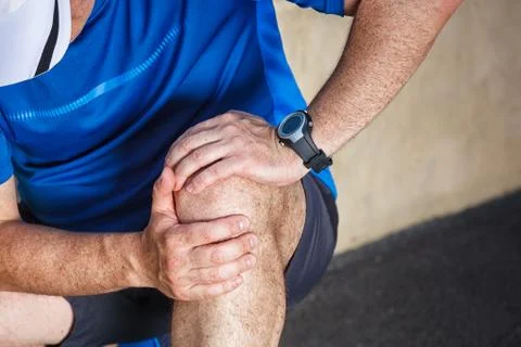 Male runner having problems in knee joint. Stock-Fotos