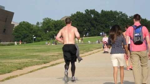 Male Runner Jogging Down City Street in Washington DC, 4K Stock Footage 79478248