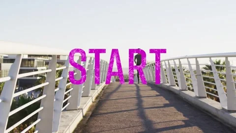 Male runner jogging toward camera on curved bridge, magenta START overlay Stock Footage 333965409