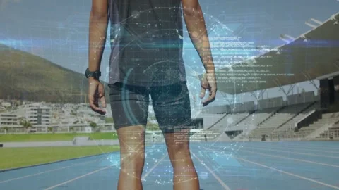 Male runner lowering hands, stepping into blocks and preparing start for track Stock Footage 332613654