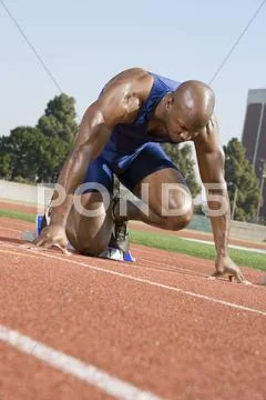Male Runner In The Start Up Position Stock Photos
