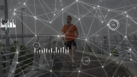 Male runner starting run from bridge, checking device for training, tech HUD Stock Footage 333478004