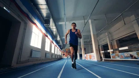 Male runner training with a prosthesis, bionic leg. Stock Footage 105003715
