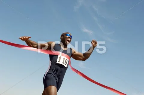 Male Runner Winning Race Stock Photos