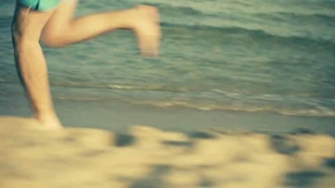 Male Running on the Beach Stock Footage 129281748
