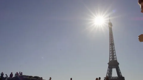 Male running though Paris with Eiffel tower in the background. Stock Footage 63031518