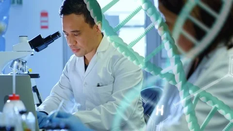 Male scientist placing sample into microscope for lab research DNA helix and hex Stock Footage 333774448