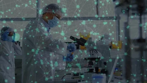 Male scientist taking sample in lab using microscope checking laptop node 스톡 동영상 330546134