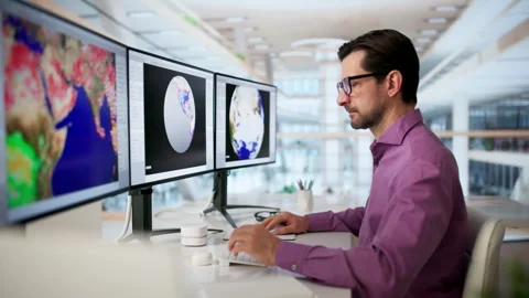 Male Scientist Uses Computer To Analyze Weather Forecast Stock Footage 335457493