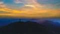 The male silhouette on a mountain against the beautiful sunset 4k or 4k+ Resolution